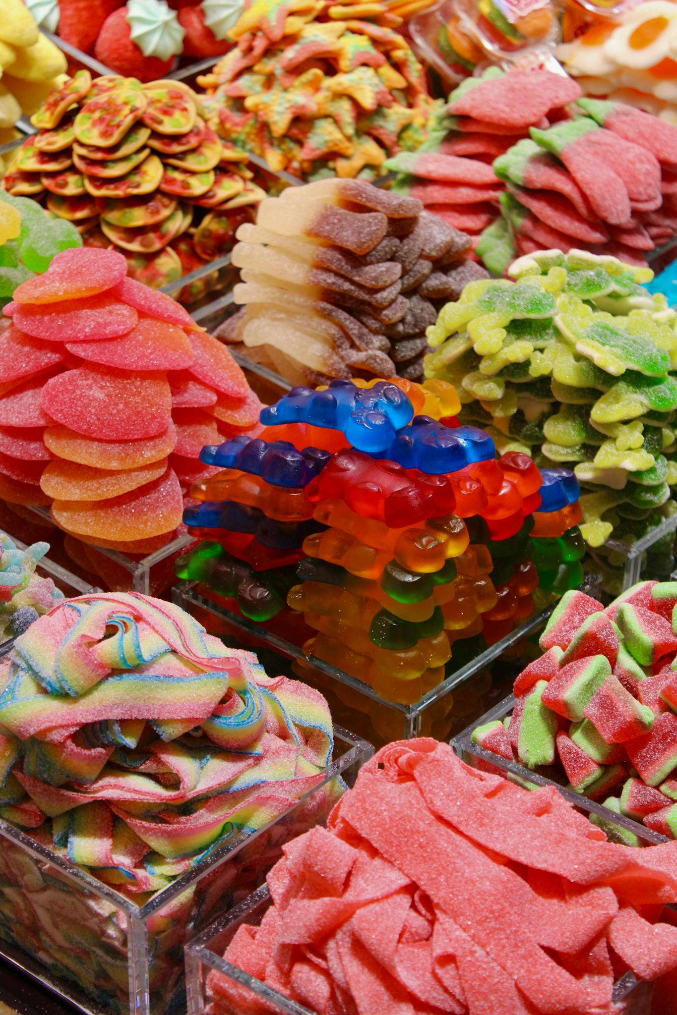 A vivid collection of assorted gummy candies in various shapes and colors.